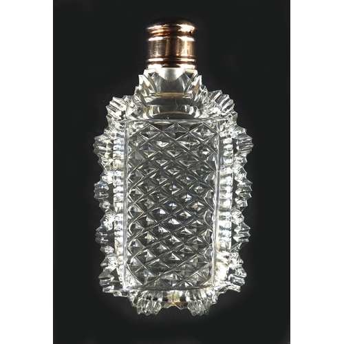 87 - Victorian cut glass scent bottle with unmarked gold lid, 7.5cm high