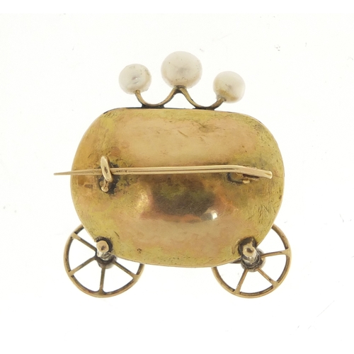 643 - Antique unmarked gold carriage brooch with rotating wheels, set with diamonds, emeralds, pearls and ... 