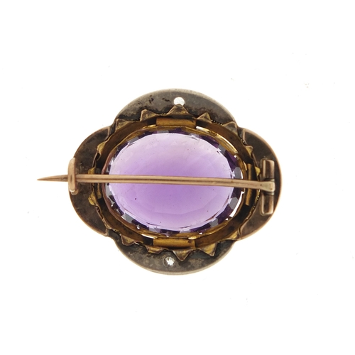 645 - Unmarked gold amethyst brooch with diamond and black enamel surround, 3cm in length, 10.9g