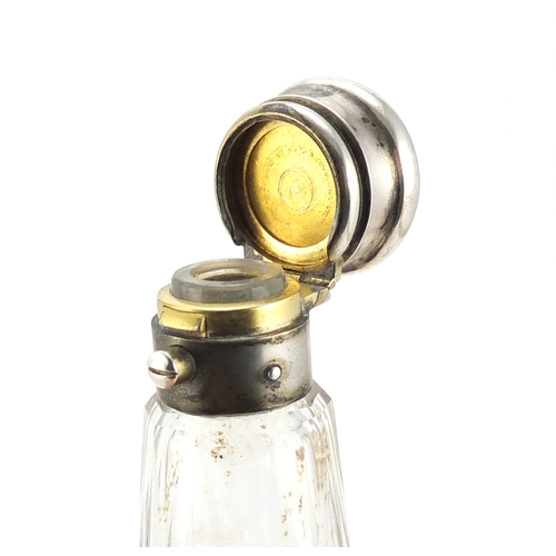 612 - Victorian cut glass double ended scent bottle, with silver coloured metal mounts, 12.5cm in length