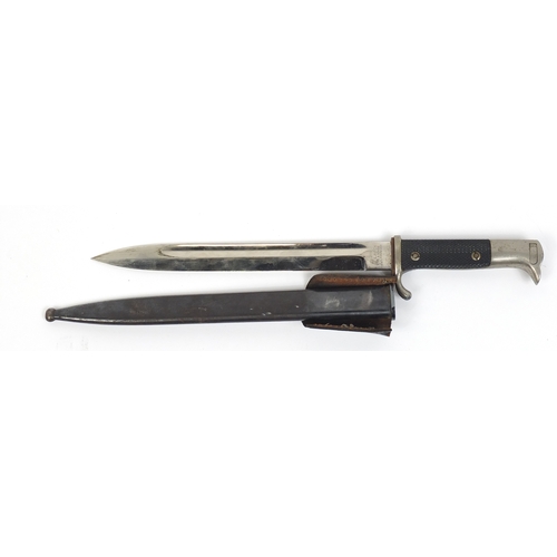 270 - German Military interest bayonet with scabbard, the steel blade engraved E Pack, 40.5cm in length