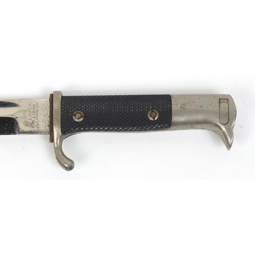 270 - German Military interest bayonet with scabbard, the steel blade engraved E Pack, 40.5cm in length