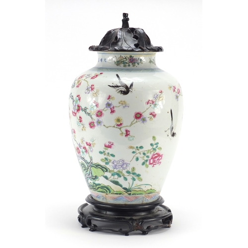 305a - Chinese porcelain vase with carved hardwood lid and stand, finely hand painted in the famille rose p... 