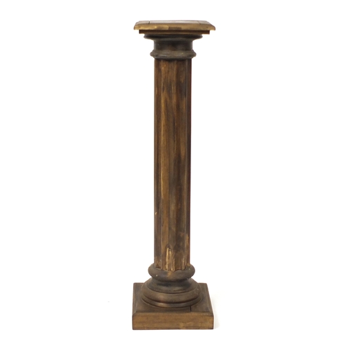 130 - Stained pine torchiere, 107cm high