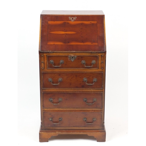 86 - Yew bureau, the fall enclosing a fitted interior above four drawers, 100cm high x 51cm wide x 46cm d... 