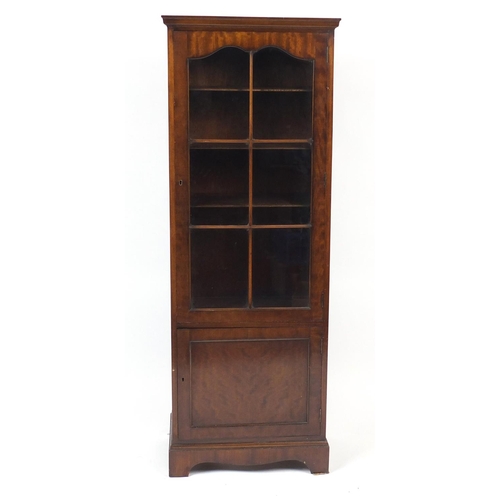 57 - Mahogany bookcase fitted with two adjustable shelves above a cupboard base, 165cm high x 60cm wide x... 