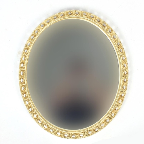 179 - Oval cream and gilt framed mirror with bevelled glass, 69cm x 59cm