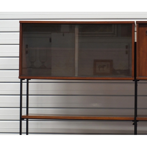 2004 - 1960's teak ladder rack style modular wall unit by Avalon with cupboards doors, sliding doors and sh... 