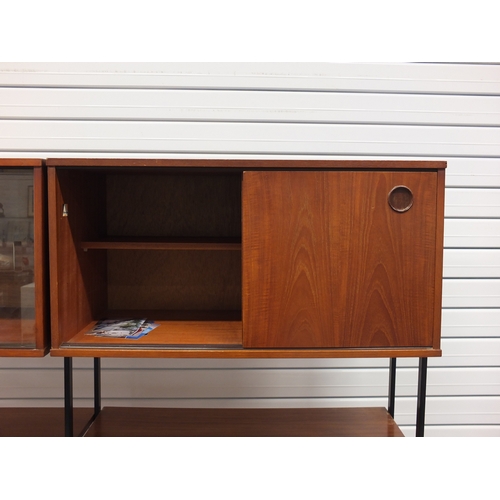 2004 - 1960's teak ladder rack style modular wall unit by Avalon with cupboards doors, sliding doors and sh... 