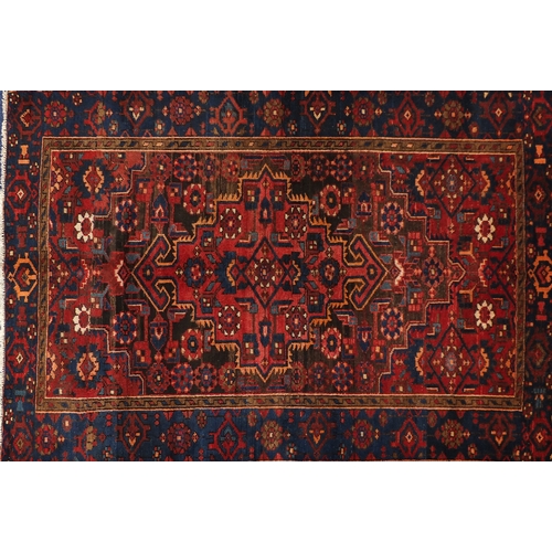 2027A - Red ground Heriz rug, 183cm x 127cm