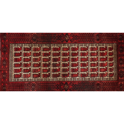 2052 - Persian red ground rug, 182cm x 90cm