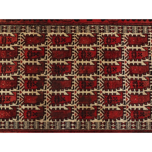2052 - Persian red ground rug, 182cm x 90cm