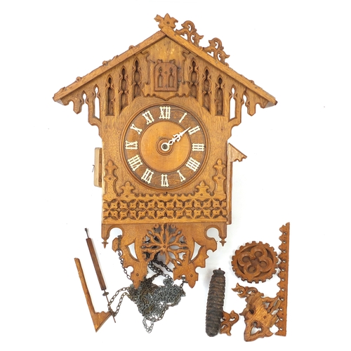 25 - Carved light oak black forest cuckoo clock, 50cm high