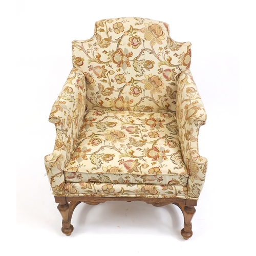 2022 - Arts and Crafts design carved oak chair arm chair with cream floral upholstery, 87cm high
