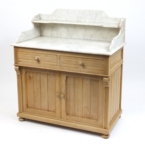 2037 - Pine wash stand with marble top above two drawers and a pair of cupboard doors, 112cm H x 100cm W 55... 