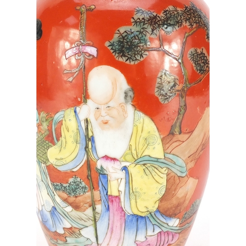 192 - Chinese porcelain iron red ground vase, hand painted in the famille rose palette with Shou Lau holdi... 