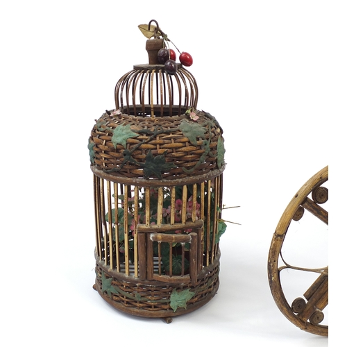 181 - Cane and wicker tricycle planter and a bird cage