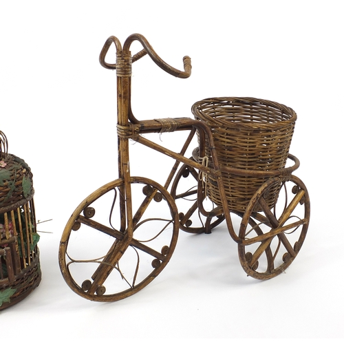 181 - Cane and wicker tricycle planter and a bird cage