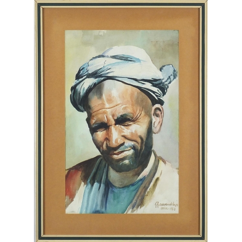 47 - Head and shoulders portrait of an Arab male, watercolour, bearing a signature possibly Ghaussudch ? ... 