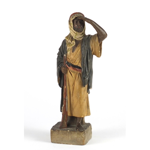 162 - Terracotta figure of an Arab hunter, 22cm high