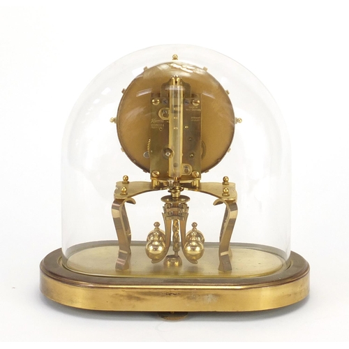 194 - Kundo brass Anniversary clock with glass dome, 23cm high