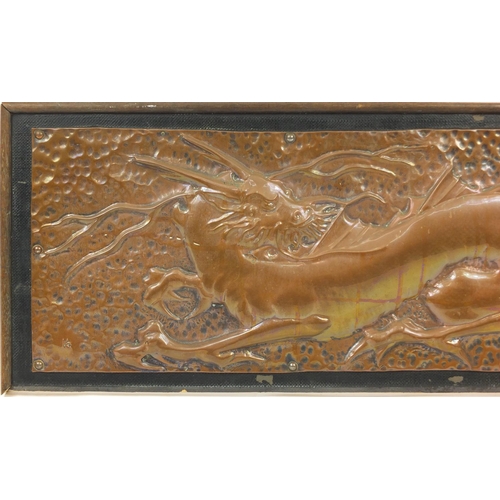 110 - Arts & Crafts Keswick style copper panel embossed with a dragon, framed, 90cm x 28.5cm