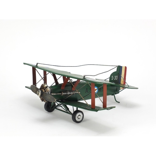 101 - Tinplate model of a military aeroplane, 27cm in length