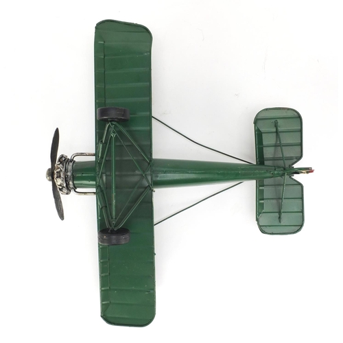 101 - Tinplate model of a military aeroplane, 27cm in length