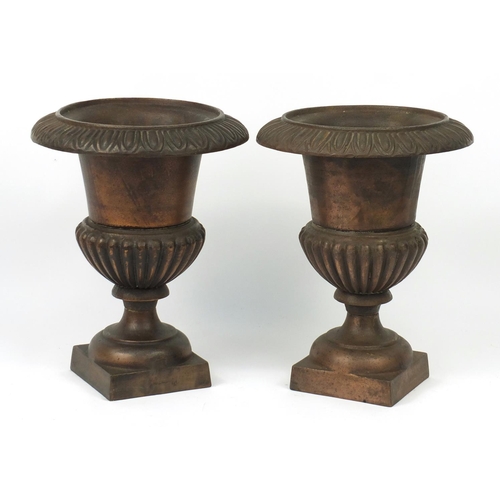 13 - Pair of coppered cast iron campana urn planters, 37cm high