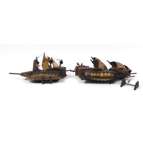 211 - Two model ships on stands, the larger 60cm wide