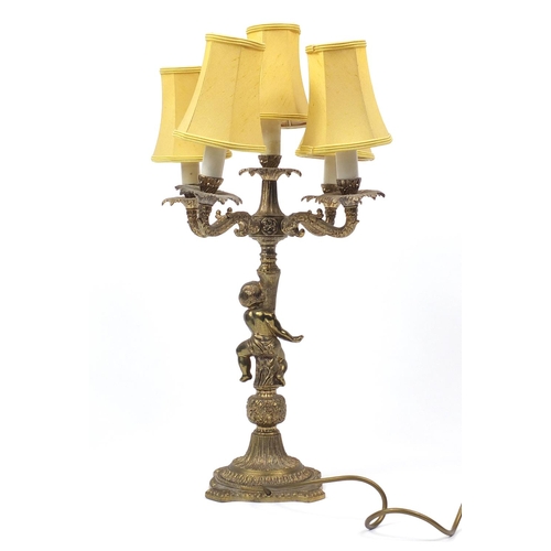 131 - Gilt brass five branch cherub table lamp with shades, 58cm high