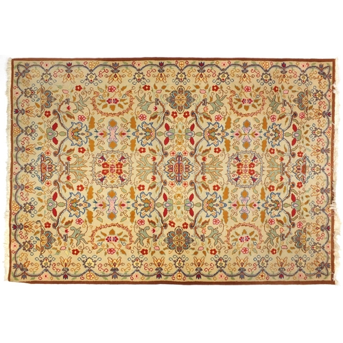 7 - Cream ground rug with all over floral design, 240cm x 170cm