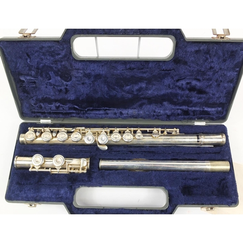 142 - Silver plated three piece Milano flute housed in a fitted case