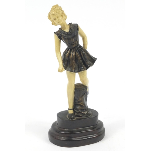 173 - Art Deco style bronzed and ivorine figure of a young girl, 22cm high