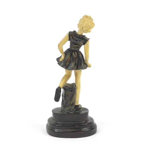 173 - Art Deco style bronzed and ivorine figure of a young girl, 22cm high