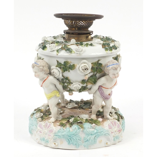 133 - 19th Century Switzendorf porcelain oil lamp base, mounted with three putti, 28cm high