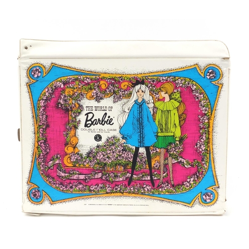 229 - The World of Barbie double doll case including vintage dolls and clothes