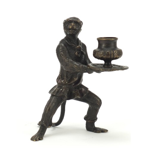 187 - Patinated bronze candlestick in the form of a monkey, 16cm high