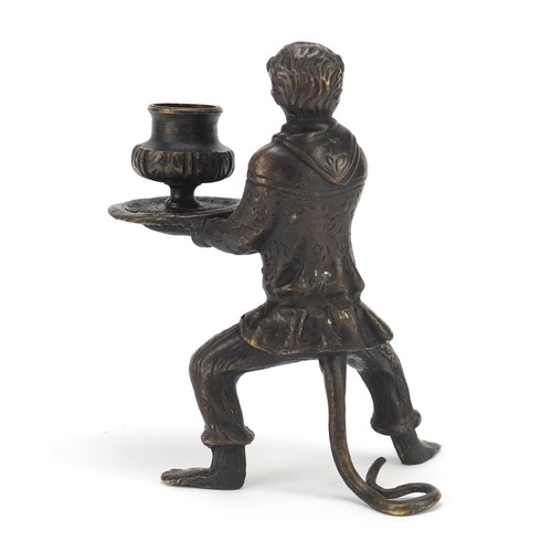 187 - Patinated bronze candlestick in the form of a monkey, 16cm high