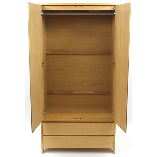 10 - Contemporary lightwood two door wardrobe with two drawers to the base, 200cm H x 100cm W x 56cm D