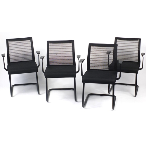 27 - Set of four black reception chairs with mesh backs, 83cm high
