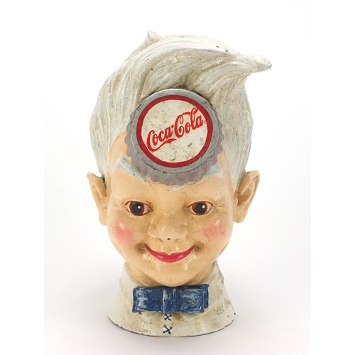 192A - Vintage Coca Cola cast iron money bank, 19cm high