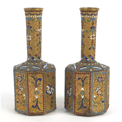 155 - Two Chinese enamel vases decorated with flowers, each 15.5cm high