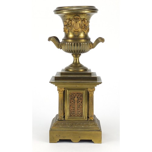 120 - Ornate gilt brass campana urn on stand, 30cm high