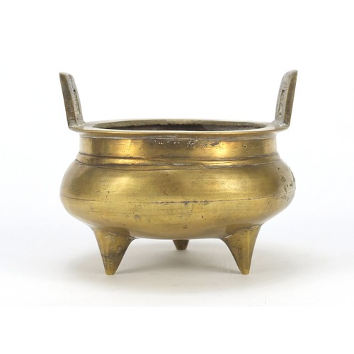 151 - Chinese bronze incense burner with twin handles, character marks to the base, 12cm in diameter