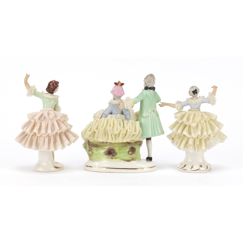 2167 - Three German porcelain lace figurines by Dresden, the largest 13cm high