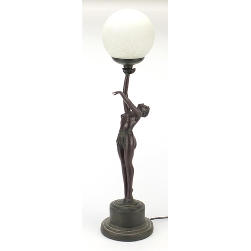 2078 - Bronzed table lamp in the form of a nude Art Deco dancer with globular glass shade, 69cm high