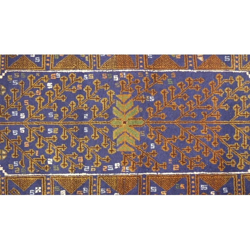 2052 - Persian blue ground rug with all over geometric design, 190cm x 120cm
