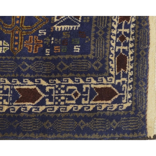 2052 - Persian blue ground rug with all over geometric design, 190cm x 120cm