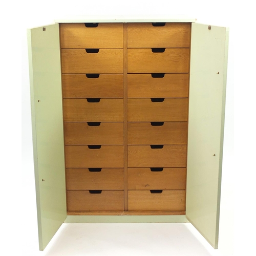 2007 - Art Deco two door cupboard enclosing sixteen bespoke fitted honey oak drawers, 146cm H x 97cm W x 61... 